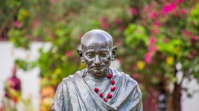 Bing wallpaper October 1, 2026. Mahatma Gandhi statue at the Sabarmati Ashram in Ahmedabad, Gujarat (© Kandarp Gupta/Alamy)