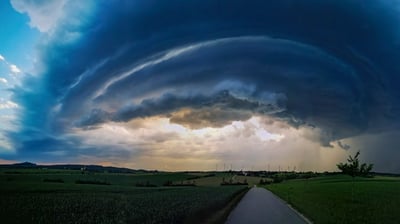 Bing wallpaper August 15, 2021. Gewitterzelle über einer Ortschaft in Baden-Württemberg (© Martin Grimm/Minden)