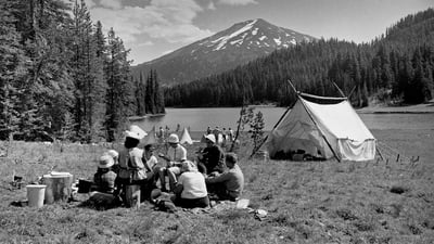 Bing wallpaper March 12, 2022. Girl Scouts camping on the shore of Todd Lake in 1960, Deschutes National Forest, Oregon (© CORBIS/Corbis via Getty Images)