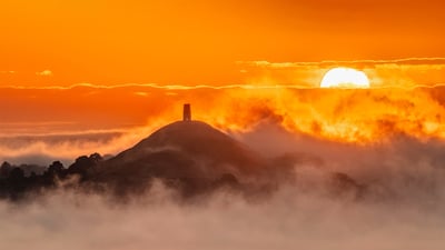 Bing wallpaper June 21, 2022. View of Glastonbury Tor from Walton Hill, Somerset, England (© Guy Edwardes/Minden Pictures)