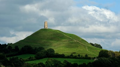 Bing wallpaper June 26, 2019. Glastonbury Tor and St. Michael's Tower in England for the start of the Glastonbury Festival (© Spraggon Photography/Getty Images Plus)