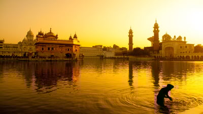 Bing wallpaper April 12, 2021. Sunset at Golden Temple in Amritsar, India (© szefei/shutterstock)