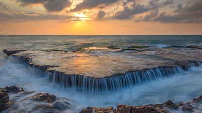 Bing wallpaper March 26, 2024. Seawater cascades over an ancient coral reef, Hang Rai, Vietnam (© Thang Tat Nguyen/Getty Images)