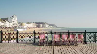 Bing wallpaper August 4, 2019. Deckchairs on Hastings Pier, East Sussex, England (© ams images/Alamy)
