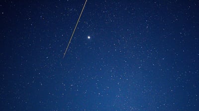 Bing wallpaper June 12, 2026. はやぶさ 2 から切り離されたカプセル (© MORGAN SETTE/Getty Images)