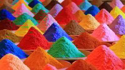 Bing wallpaper March 18, 2022. Multicolored powders for sale during Holi (© Nuno Valadas/Getty Images)