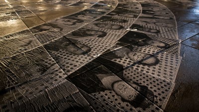 Bing wallpaper October 4, 2025. 'Inside Out' by JR at the Nathan Phillips Square, Nuit Blanche 2015, Toronto (© Melissa Renwick/Contributor/Getty Images)