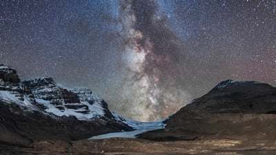 Bing wallpaper October 13, 2023. Milky Way over Athabasca Glacier in Jasper National Park, Canada (© Alan Dyer/Stocktrek Images/Getty Images)