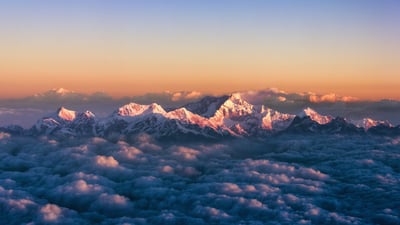 Bing wallpaper November 26, 2019. Kanchenjunga, on the India-Nepal border, among a sea of clouds at sunrise (© Alexander W Helin/Getty Images)