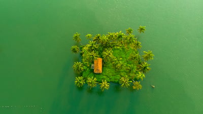 Bing wallpaper November 20, 2025. Small island with a building near Ezhikkara, Kerala (© gulfu photography/Moment/Getty Images)