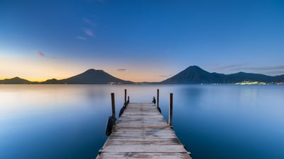 Bing wallpaper July 8, 2026. Sunrise at Lake Atitlán, Guatemala (© shayes17/Getty Images)