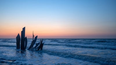 Bing wallpaper June 6, 2024. Les Braves monument on Omaha Beach, Normandy, France (© Christopher Furlong/Getty Images)