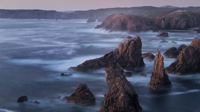 Bing wallpaper June 6, 2021. Sea stacks on the Isle of Lewis, Outer Hebrides, Scotland (© Cody Duncan/Cavan Images)
