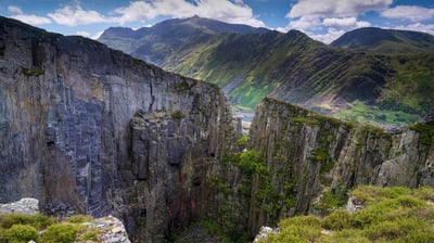 Bing wallpaper March 27, 2021. Mount Snowdon and the Llanberis Pass from Dinorwic Slate Quarry, Snowdonia National Park, North Wales, UK (© Alan Novelli/Alamy Stock Photo)