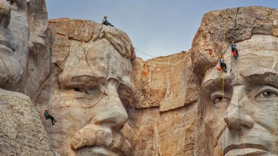 Bing wallpaper September 6, 2021. Park service employees inspecting Mount Rushmore National Memorial, South Dakota (© Universal Images Group via Getty Images)