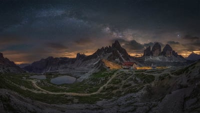 Bing wallpaper March 28, 2023. Milky Way above the Tre Cime di Lavaredo, South Tyrol, Italy (© Juan Romero/Cavan Images)
