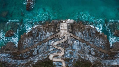 Bing wallpaper January 10, 2024. Stairs on the shoreline at Mylopotamos Beach, Thessaly, Greece (© Orestis Zoumpos/Amazing Aerial Agency)
