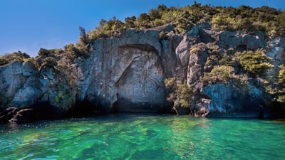 Bing wallpaper August 9, 2021. Māori rock carving by Matahi Whakataka-Brightwell, Lake Taupo, North Island, New Zealand (© Evgueni Zverev/Alamy)
