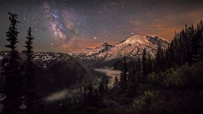 Bing wallpaper March 2, 2022. Moonlight and the Milky Way over Mount Rainier in Mount Rainier National Park, Washington (© Brad Goldpaint/Cavan)
