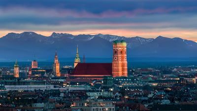 Bing wallpaper July 12, 2026. München mit der Frauenkirche vor den Alpen, Bayern (© MarcelStrelow/Getty Images)