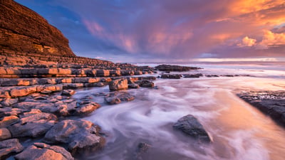 Bing wallpaper January 4, 2021. Sunset over Nash Point on the Glamorgan Heritage Coast, South Wales in winter. (© AWL Images/DanitaDelimont.com)