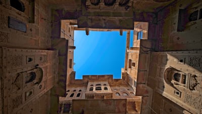Bing wallpaper September 30, 2026. View into the sky from Nathmal Ki Haveli courtyard, Jaisalmer, Rajasthan (© Emad Aljumah/Moment/Getty Images)