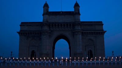 Bing wallpaper December 3, 2024. Indian Navy soldiers in front of the Gateway of India, Mumbai (© Danish Siddiqui/REUTERS)