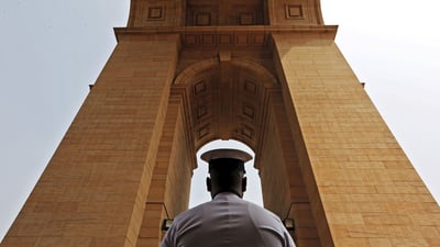 Bing wallpaper December 3, 2019. A sailor pays respect at India Gate War Memorial, Delhi. (© Adnan Abid/Reuters)