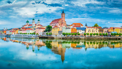 Bing wallpaper July 13, 2023. The city of Passau reflected in the Danube, Bavaria, Germany (© Scott Wilson/Alamy)