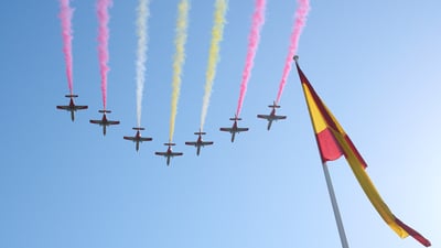 Bing wallpaper October 11, 2026. La Patrulla Águila sobrevuela durante el Desfile Militar del Día Nacional, Madrid, España (© Carlos Alvarez/Getty Images)