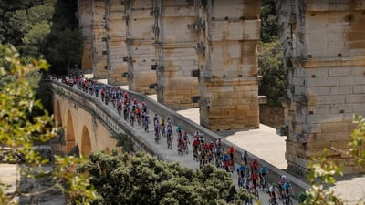 Bing wallpaper July 1, 2023. Tour de France cyclists crossing the Pont du Gard, France (© Gonzalo Fuentes/Reuters)