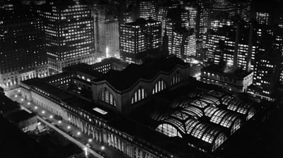 Bing wallpaper November 27, 2021. Aerial view of Penn Station and the New York City skyline at night in the 1950s (© R. Gates -Staff/Getty Images)