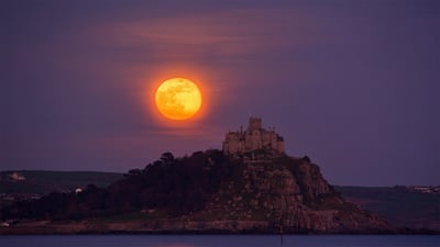 Bing wallpaper April 7, 2020. The 2017 April full moon, or pink moon, rises over St. Michael's Mount, Cornwall, England (© Simon Maycock/Alamy Live News)