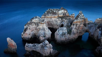 Bing wallpaper June 10, 2019. Ponta da Piedade rock formations off the coast of Algarve, Portugal (© David Santiago Garcia/Offset)