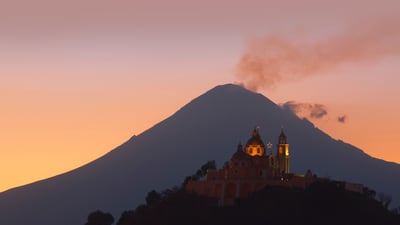 Bing wallpaper May 5, 2023. Church of Nuestra Señora de los Remedios and Popocatépetl, Puebla, Mexico (© Radius Images/Shutterstock)