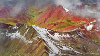 Bing wallpaper November 29, 2021. Aerial view of snowy peaks of Vinicunca (aka Rainbow Mountain), Peru (© Jude Newkirk/Amazing Aerial Agency)