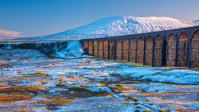 Bing wallpaper February 3, 2025. Ribblehead Viaduct and Ingleborough mountain, North Yorkshire, England (© AWL Images/DanitaDelimont.com)