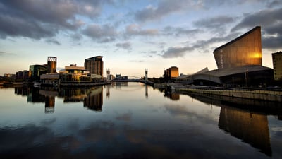 Bing wallpaper December 9, 2020. The Lowry Theatre and Imperial War Museum North, with reflections at Salford Quays, Greater Manchester (© Michelle McMahon/Getty Images)
