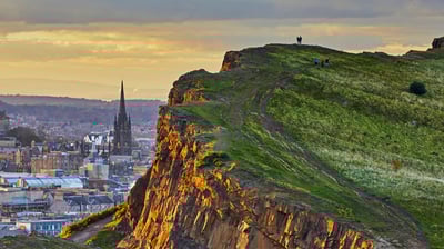 Bing wallpaper August 6, 2021. Salisbury Crags in Holyrood Park overlooking Edinburgh, Scotland (© Andrew Merry/Getty Images)