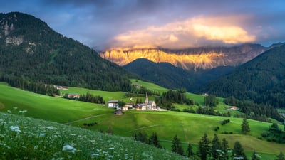 Bing wallpaper August 11, 2025. Village of Santa Maddalena, Dolomites, Italy (© Sakrapee Nopparat/Getty Images)