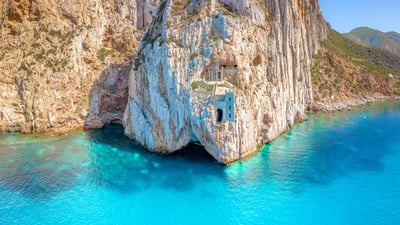 Bing wallpaper May 14, 2025. Porto Flavia, Sardinia, Italy (© Francesco Riccardo Iacomino/Getty Images)