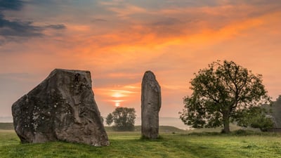 Bing wallpaper June 19, 2020. Dawn breaks over the ancient Sarsen Stones at Avebury, Wiltshire, at Summer Solstice (© Terry Mathews/Alamy Stock Photo)