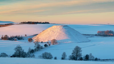 Bing wallpaper January 26, 2023. Silbury Hill in the winter snow at sunrise, Avebury, Wiltshire (© Tim Gainey/Alamy)