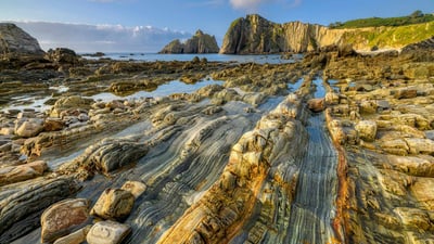 Bing wallpaper November 5, 2023. Quartzite formation, Playa del Silencio, Asturias, Spain (© Jean-Philippe Delobelle/Minden Pictures)