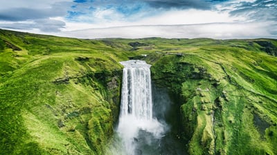 Bing wallpaper August 23, 2023. Skógafoss waterfall, Iceland (© Maridav/Shutterstock)