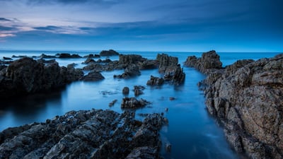 Bing wallpaper November 30, 2020. View of the coastline at dusk, Saint Andrews, Fife (© Graham Hutchison/500px/Getty Images)
