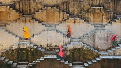 Bing wallpaper March 22, 2020. Local women climbing a stepwell near Amber Fort in Jaipur, Rajasthan, India (© Shanna Baker/Offset)
