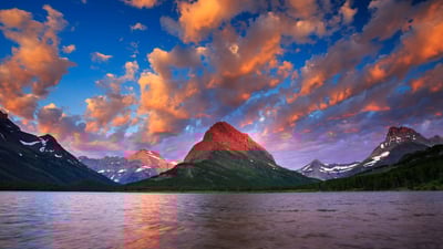 Bing wallpaper August 25, 2024. Sunrise over Swiftcurrent Lake, Glacier National Park, Montana (© Jason Savage/Tandem Stills + Motion)