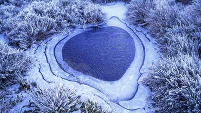 Bing wallpaper June 29, 2020. Frozen tarn, Cradle Mountain, Tasmania (© TED MEAD/Getty Images)