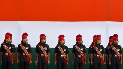 Bing wallpaper August 14, 2020. Soldiers stand guard in front of a tricolour flag rehearsal (© Adnan Abidi/Reuters)